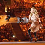 American Paralympic snowboarder Amy Purdy dances with a robot during the opening ceremony of the Rio 2016 Paralympic Games at the Maracana stadium in Rio de Janeiro on September 7, 2016.