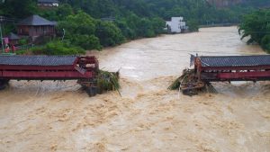 An ancient bridge is seen collapsed as typhoon Meranti hits southeast China, in Yongchun, Fujian province, China, on September 15, 2016. Typhoon Meranti made landfall in Fujian early September 15 with winds up to 230kph, knocking out electricity in some areas and causing rail delays.