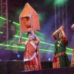Chinese folk dancer Kan Li Na, 11, (L) from Beijing performs with Indian folk dancers during the full dress rehearsal on the eve of Vibrant Navratri Mahotsav at the GMDC ground, late September 30, 2016. Folk dancers from across India are participating in the Vibrant Navratri Mahotsav as the Hindu Navratri — the Dance Festival of Nine Nights — begins on October 1, 2016.