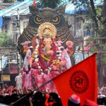 Devotees carry the Lalbaugcha Raja idol to Girgaon Chawpatty for immersion on the last day of Ganesh festival, in Mumbai.