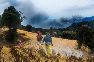Farmers work nearby the Turrialba volcano in Cartago, 46 Km east of San Jose, Costa Rica.