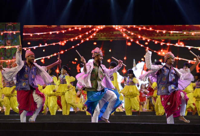 Folk dancers perform during the full dress rehearsal on the eve of Vibrant Navratri Mahotsav at the GMDC ground, late September 30, 2016. Folk dancers from across India are participating in the Vibrant Navratri Mahotsav as the Hindu Navratri - the Dance Festival of Nine Nights - begins on October 1, 2016.