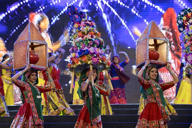 Folk dancers perform during the full dress rehearsal on the eve of Vibrant Navratri Mahotsav at the GMDC ground, late on September 30, 2016. Folk dancers from across India are participating in the Vibrant Navratri Mahotsav as the Hindu Navratri — the Dance Festival of Nine Nights — begins on October 1, 2016.