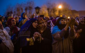 Kashmiri Muslim women react as a priest (not pictured) displays a relic believed to be a hair from the beard of Prophet Mohammad during Eid-e-Milad, the birth anniversary of the Prophet, at the Hazratbal Shrine in Srinagar on December 12, 2016.