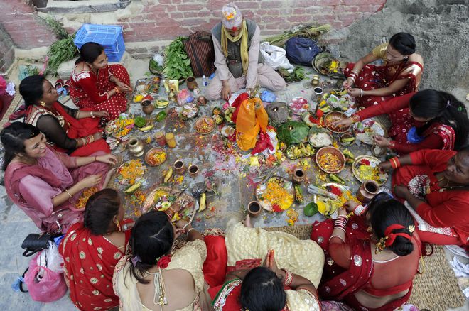 Nepalese Hindu devotees pray at Bagmati river during the Rishi Panchami