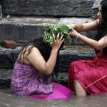 Nepalese Hindu women take a ritual bath in the Bagmati River during Rishi Panchami festival in Kathmandu.