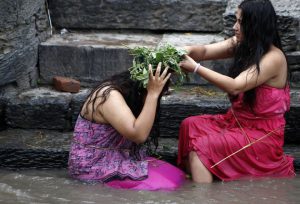 Nepalese Hindu women take a ritual bath in the Bagmati River during Rishi Panchami festival in Kathmandu.