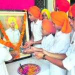 Students pay floral tributes to Shaheed Bhagat Singh on his birth anniversary at Lucky Modern High School in Patiala