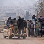 Syrian rebel fighters and civilians who were evacuated from rebel-held neighbourhoods in the embattled city of Aleppo arrive in the opposition-controlled Khan al-Aassal region, west of the embattled city, on December 16, 2016.