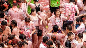 There are various theories which includes that it began with local food fight among friends, a practical joke on a bad musician, a volley of tomatoes from bystanders at a carnival parade and many more.