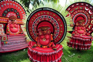 'Theyyam' artists perform during the 'Kummati Kali' as part of the annual Onam festival celebrations in Thrissur district of Kerala.
