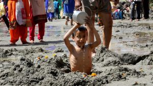 A child devotee offering prayer during the three-day Chadhi Yatra ahead of Navratra festival, at Parmandal, about 25 km from Jammu