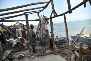 A man starts repairs on his home destroyed by Hurricane Matthew, in Jeremie, in western Haiti, on October 7, 2016. The full scale of the devastation in hurricane-hit rural Haiti became clear as the death toll surged over 400, three days after Hurricane Matthew leveled huge swaths of the country’s south.