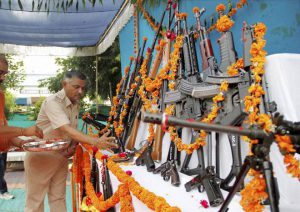 A policeman offers prayers to weapons at a police headquarters to mark Dussehra in Ahmedabad, Gujarat, on October 11, 2016.