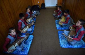 Afghan music students play the Robab during class at the Afghanistan National Institute of Music in Kabul.