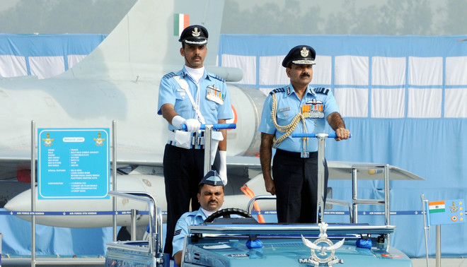 Air Chief Marshal Arup Raha (right) at the 84th Air Force Day at the Hindon air base on the outskirts of New Delhi on October 8, 2016.