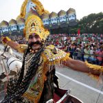 An artiste dressed as demon king Ravana acts in a religious play during Vijaya Dashmi, or Dussehra festival celebrations in Chandigarh on October 11, 2016.