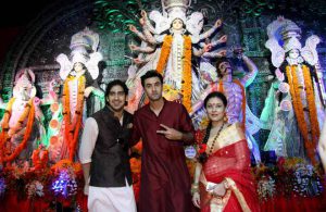 Bollywood film director Ayan Mukerji, (L), actors Ranbir Kapoor (C) and Sarbani Mukerji attend the celebration of the North Bombay Sarbojanin Durga Puja, in Mumbai on October 9, 2016.