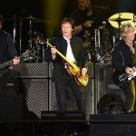 (L-R) Guitarist Rusty Anderson, Sir Paul McCartney and Brian Ray perform onstage during Desert Trip at the Empire Polo Field on October 8, 2016 in Indio, California.