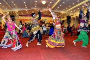 In this photograph taken on October 5, 2016, Gujarati dancers perform the dandiya raas during the celebration of the nine-day Navaratri festival, in Bangalore on October 5, 2016.