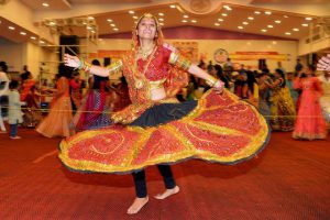 In this photograph taken on October 5, 2016, Gujarati dancers perform the dandiya raas during the celebration of the nine-day Navaratri festival, in Bangalore on October 5, 2016. Navaratri, a festival dedicated to the worship of the Hindu goddess Durga, is celebrated by Hindus around the world and symbolises the conquest of good over evil.