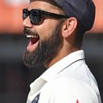 India’s Virat Kohli (R) celebrates the wicket of New Zealand’s batsman Mitchell Santner during the fourth day of third Test cricket match between the two teams at the Holkar Cricket Stadium in Indore on October 11, 2016.