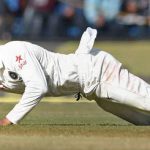 India’s Virat Kohli dives to stop the ball during the fourth day of third Test cricket match between the two teams at the Holkar Cricket Stadium in Indore on October 11, 2016.