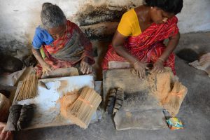 Indian skilled workers prepare sandalwood agarbattis — incense sticks — at a small-scale industry before Diwali, the Hindu festival of lights, in Ahmedabad on October 21, 2016.