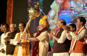 Prime Minister Narendra Modi being presented a mace as he is welcomed during Dussehra celebrations at Aishbagh Ram Leela in Lucknow, Uttar Pradesh on October 11, 2016. Governor of Uttar Pradesh, Ram Naik and the Union Home Minister Rajnath Singh are also seen.