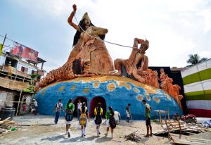Schoolgirls visit a pandal, or a temporary platform, with a giant idol of Hindu goddess Durga ahead of the Durga Puja festival in Guwahati, India, on October 6, 2016.