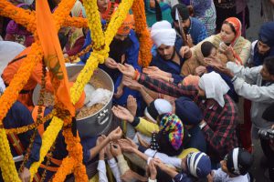 Sikh devotees take part in a gatka martial arts demonstration in a Nagar Kirtan procession in Jammu on November 12, 2016 on the eve of the 547th birth anniversary of Guru Nanak Dev.