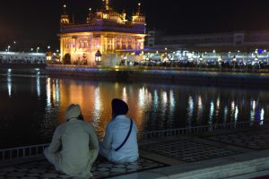 Sikh devotees pray in the early morning at the Golden Temple in Amritsar on November 12, 2016, on the eve of the 547th birth anniversary of Guru Nanak Dev.