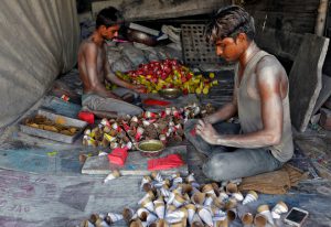 Workers make firecrackers at a factory ahead of Diwali, the Hindu festival of lights, on the outskirts of Ahmedabad, India October 21, 2016.