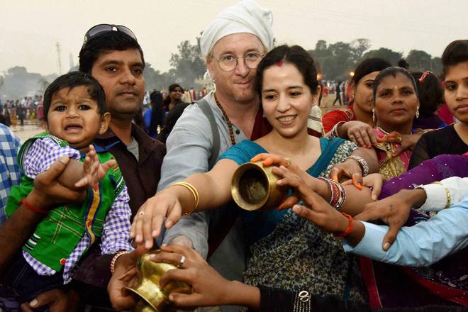 A French couple performs Chhath rituals at Bodhgaya in Bihar