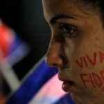 A woman with the writing ‘Fidel lives’ on her cheek participates in a massive tribute to Cuba’s late President Fidel Castro on Revolution Square in Havana, Cuba, on November 29, 2016. Castro’s ashes will go on a four-day island-wide procession starting Wednesday before being buried in the southeastern city of Santiago de Cuba on December 4.