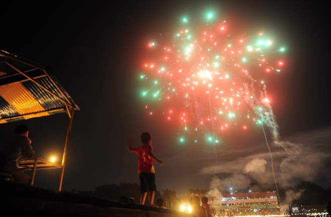 Children watch fireworks at the Madan Mohan Malviya stadium on the eve of the Hindu festival of Diwali in Allahabad on October 29.
