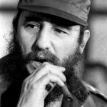 Then Cuban President Fidel Castro smokes a cigar during a meeting of the National Assembly in Havana, in this December 2, 1976, photo.
