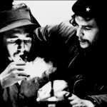 This file photo taken in the 60s shows then Cuban Prime Minister Fidel Castro (L) lighting a cigar while listening to Argentine Ernesto Che Guevara.