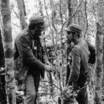 This file photo taken on October 8, 1957, shows Cuban leader Fidel Castro (L) talking with Ernesto ‘Che’ Guevara in the woods of the Sierra Maestra, Cuba.