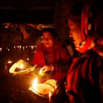Devotees holding oil lamps perform religious ritual on the bank of Bagmati River flowing through the premises of Pashupatinath Temple, during the Bala Chaturdashi festival, in Kathmandu, Nepal, on November 28, 2016.