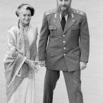 Fidel Castro, right and Indira Gandhi appear together after Castro arrived to attend the opening session of the 7th Non-Aligned Summit in New Delhi, March 7, 1983.