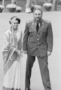 Fidel Castro, right and Indira Gandhi appear together after Castro arrived to attend the opening session of the 7th Non-Aligned Summit in New Delhi, March 7, 1983.