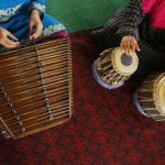 Kashmiri Muslim girls play Sufi music under the tutelage of music teacher, Muhammad Yaqoob Sheikh, on the outskirts of Srinagar
