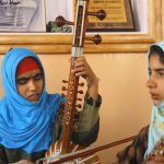 Kashmiri Muslim girls play instruments and sing Sufi music under the tutelage of music teacher, Muhammad Yaqoob Sheikh, on the outskirts of Srinagar