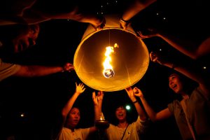 People hold up floating lanterns before they are released during the festival of Yee Peng in the northern capital of Chiang Mai, Thailand, on November 14.