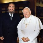 This handout photo taken on November 19, 1996, and provided by the Osservatore Romano shows Pope John Paul II and Cuban President Fidel Castro (L) posing for photographers during their historical meeting at the Vatican.