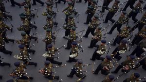 A contingent of soldiers playing bagpipes descend Raisina Hill during the practice