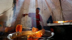 A man prepares special sweets at a small traditional factory in Kabul, Afghanistan.