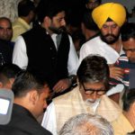 Bollywood actor Amitabh Bachchan and his actor son Abhishek Bachchan arrive to pay last respects to the deceased Indian actor Om Puri during his funeral in Mumbai on January 6, 2017