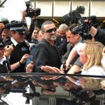 The file photo taken on November 1, 1993 in London, shows British pop superstar George Michael arriving at the high court during his attempt to break from his record company Sony.